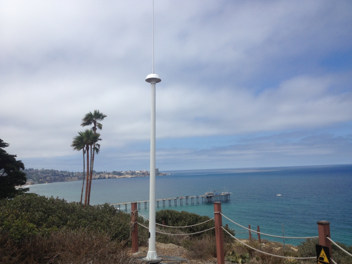 A high-frequency radar tower on shore