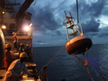 A moored RAMA buoy is deployed from the research vessel SAGAR KANYA at night